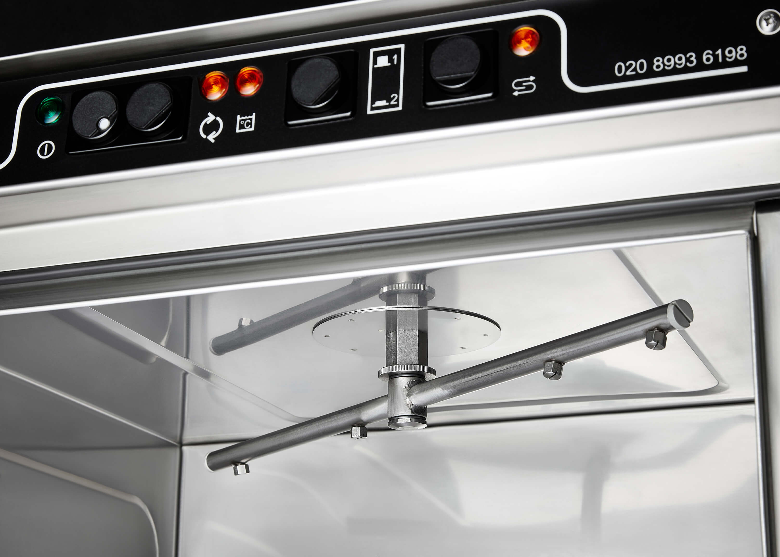 The upper rinse arm featured in the SW40 commercial dishwasher